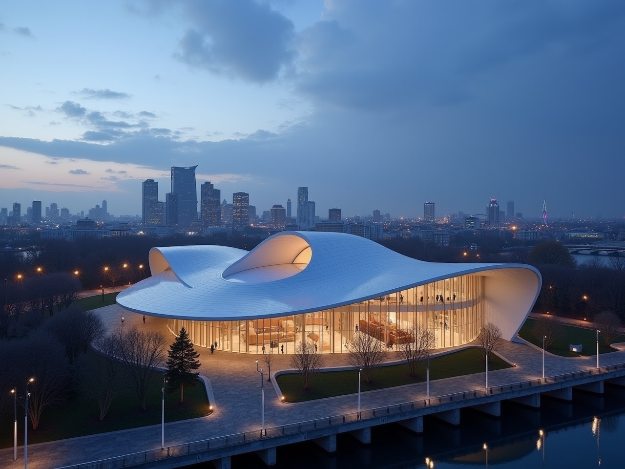 The image showcases a modern, futuristic architectural building characterized by its unique, wave-like roof structure. It is illuminated beautifully at dusk, making the design features more pronounced. In the background, the cityscape glimmers softly under the evening sky. The building is set amidst a landscaped area with trees and pathways, enhancing its appeal. This scene evokes a sense of innovation and contemporary design in urban architecture.