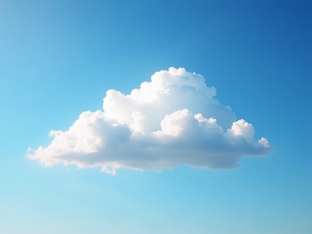 The image features a single fluffy white cloud against a bright blue sky. The cloud appears soft and airy, showcasing various shades of white. The background is a clear blue, creating a sense of tranquility. The cloud floats elegantly, dominating the center of the image. The overall feel is peaceful and calm, evoking a sense of serenity.