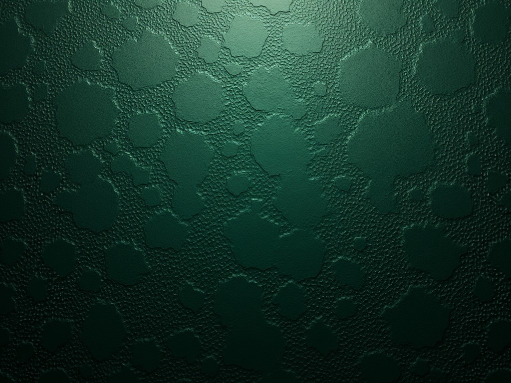 This image features a dark green embossed background that showcases various textured patterns. The surface has a unique and intriguing design, with a rich dark green color dominating the scene. The embossing creates a tactile illusion, making the surface look dynamic and interesting. Subtle lighting enhances the texture, revealing the details of the pattern beautifully. This background could serve a variety of purposes in design, from wallpapers to product packaging.