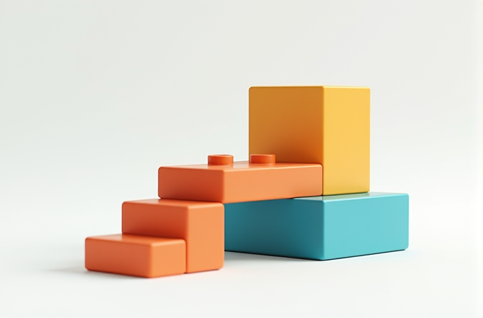 Three colorful toy bricks are arranged on a white background.