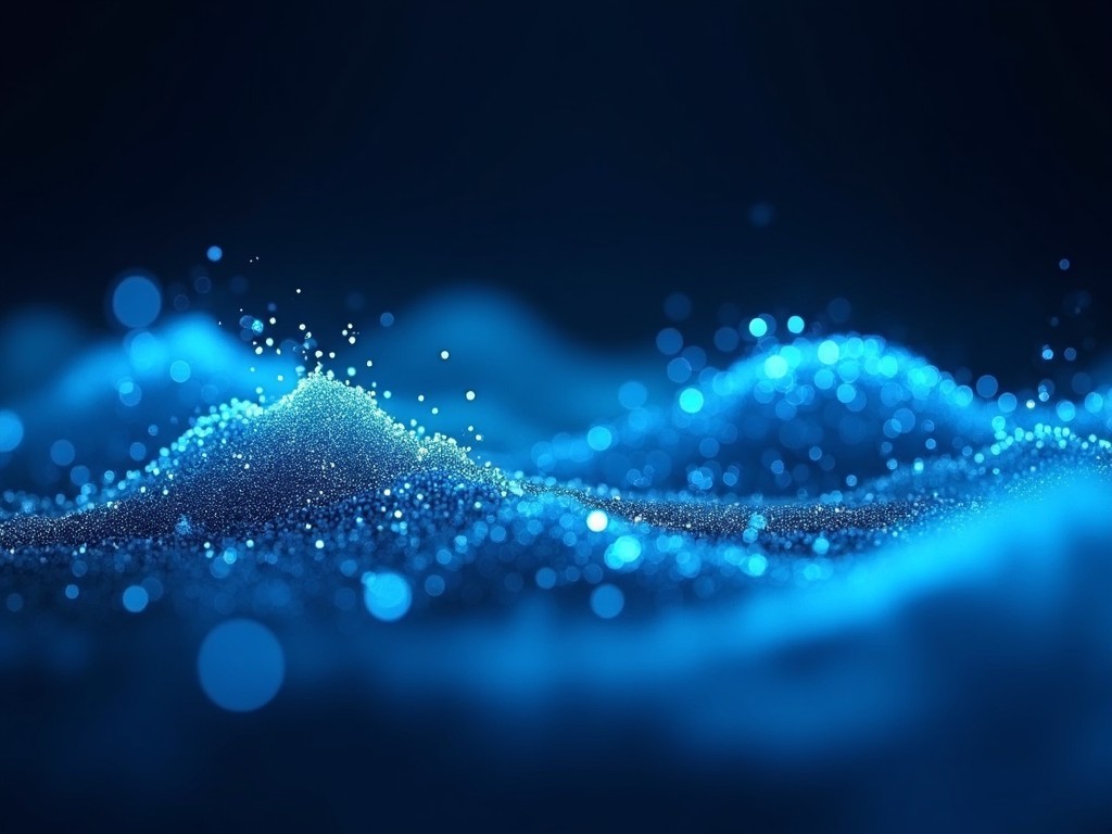 This image features fluid, abstract blue waves that shimmer with light. The waves have a soft, ethereal quality, evoking a sense of tranquility. Small particles of light dance on the surface, adding depth and texture to the scene. The color palette mainly consists of various shades of blue and cyan against a dark background. Overall, it creates a magical, dream-like atmosphere perfect for digital applications.