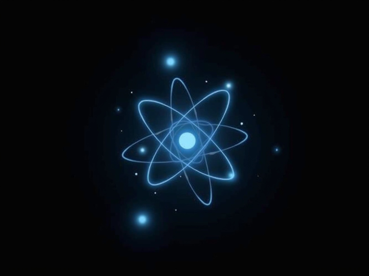 The image features a glowing representation of an atomic structure against a dark background. The central part resembles an atomic nucleus, surrounded by orbiting paths that represent electrons. The glowing elements are light blue, giving the structure a futuristic, digital appearance. The background is a deep black, allowing the luminous blue lines to stand out prominently. There are small dots scattered around the nucleus, suggesting particles or stars, adding to the scientific and cosmic theme.