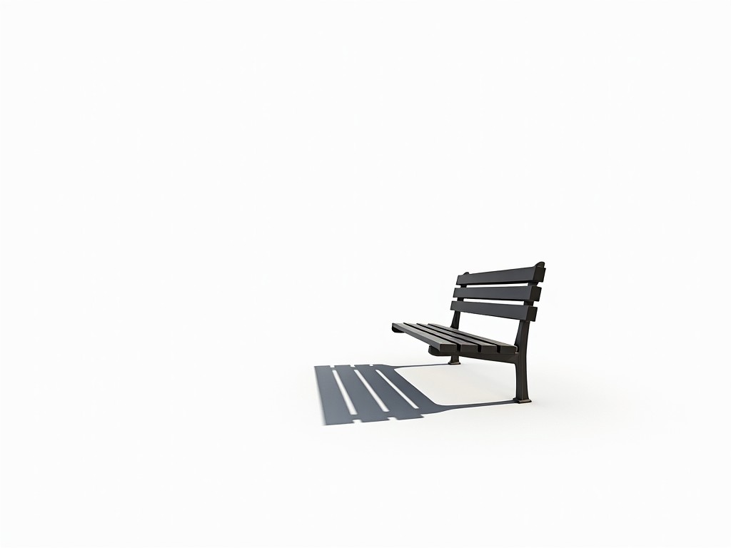 The image showcases a minimalist setting, featuring a black park bench against a bright white background. The bench is positioned toward the viewer, allowing a clear view of its structure. Its shadow stretches dramatically to the left, creating a striking contrast with the white space around it. This composition emphasizes simplicity and elegance, focusing on the interplay between light and shadow. The overall look is clean and modern, ideal for design or architectural discussions.