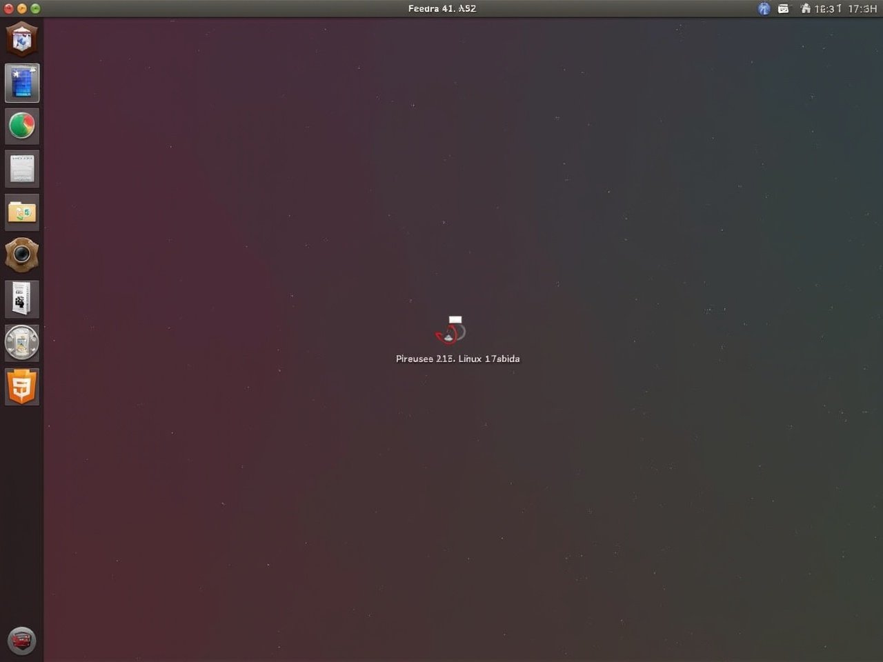 This image shows the desktop screen of Fedora 41, a popular Linux operating system. The wallpaper features a gradient background in deep red to dark blue tones. In the center, we see the Fedora logo indicating that the system is booting up. This visual represents the impressive aesthetic of the Linux environment on a laptop. It highlights the user-friendly interface that Fedora offers to its users. This scene exemplifies modern operating systems designed for efficiency and versatility in technology.