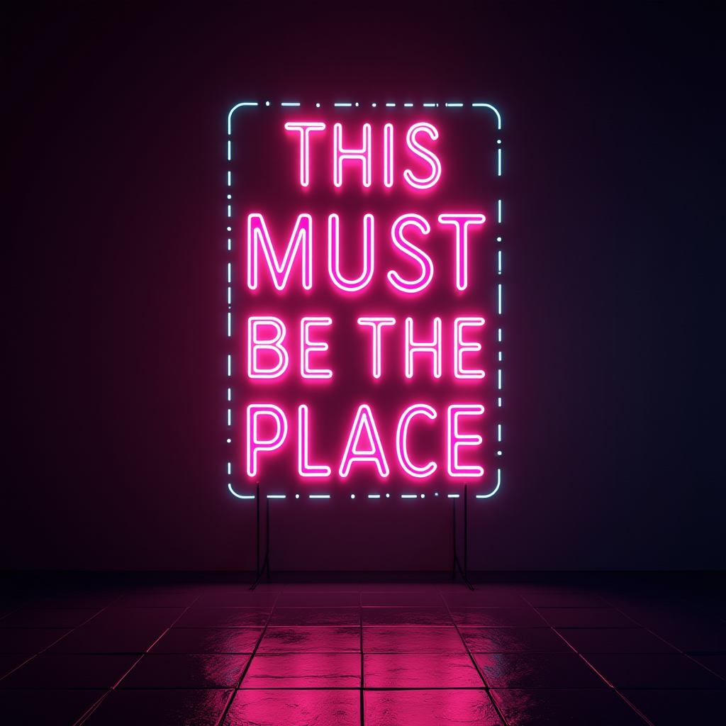 A pink and blue neon sign reads 'THIS MUST BE THE PLACE' against a dark background, reflecting on a tiled floor.